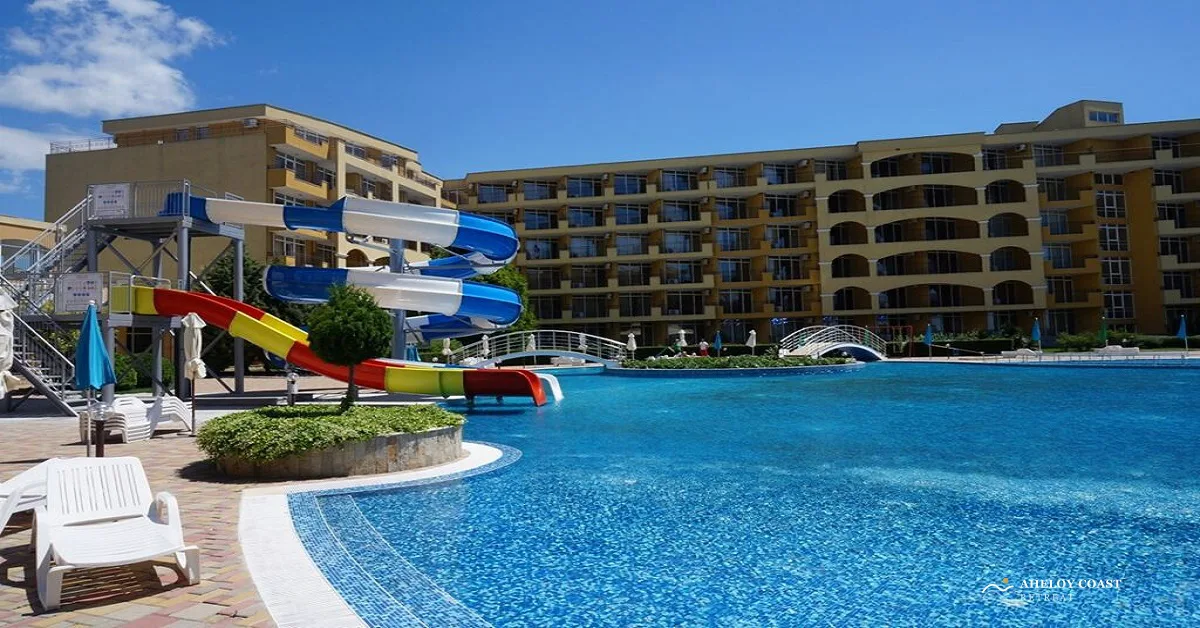 Waterslide tower in red, blue, and yellow at the larger of the two Midia Family Resort pools